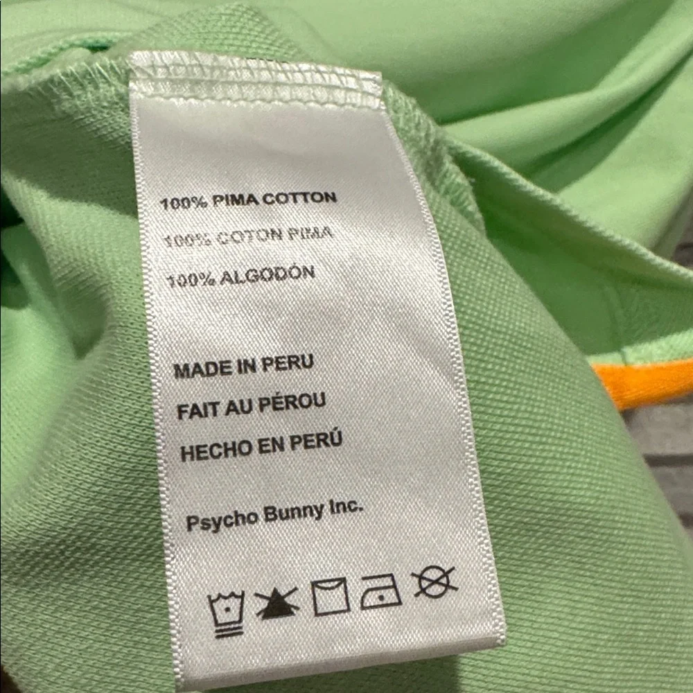118. Psycho Bunny Light Green men’s Polo with Orange Accents, pre owned size. 6